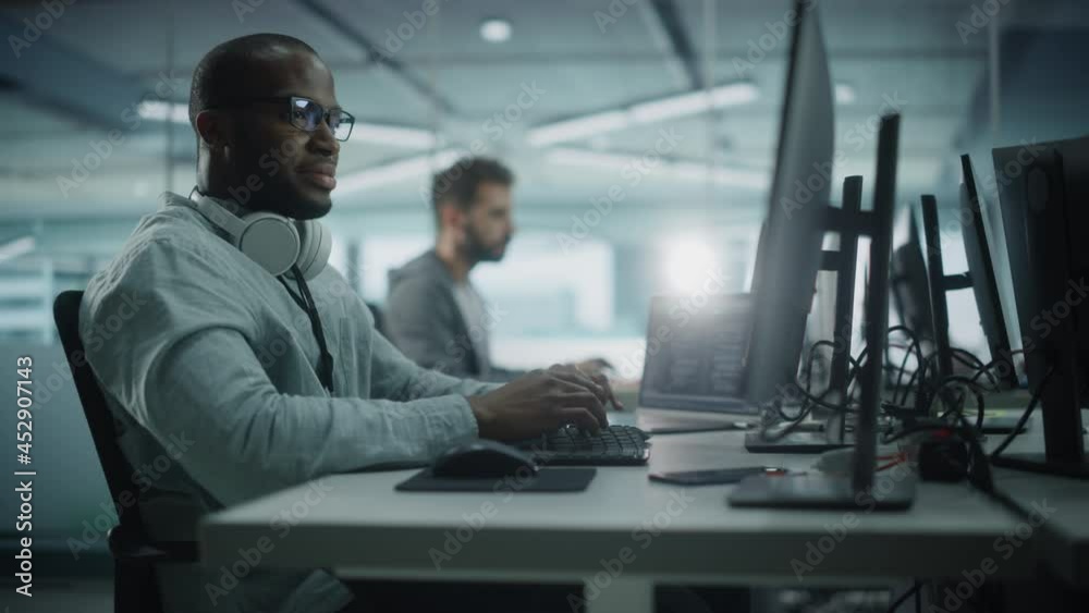 Aufkleber Office: Enthusiastic Black IT Programmer Working on Desktop Computer. Specialist Creating Innovative Software. Engineer Developing Inspirational App, Program, Video Game. Happy Workplace. Arc Shot