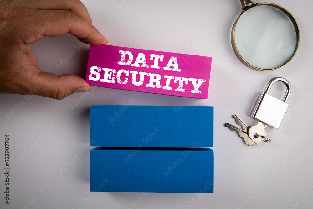 Sticker data security. colored blocks, padlock and magnifying glass on a white background