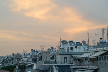 Cityscape of residential area in Athens at evening twilights. Urban architecture. Solar panels and...