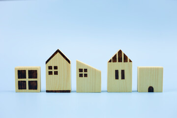 Difference three house model on pastel blue background, Planning to buy property.