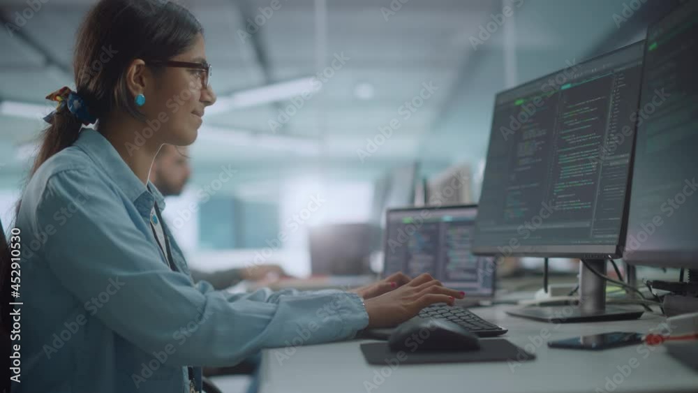 Poster Diverse Office: Enthusiastic Indian IT Programmer Working on Desktop Computer. Female Specialist Creating Innovative Software. Engineer Developing App, Program, Video Game. Writing Code in Terminal