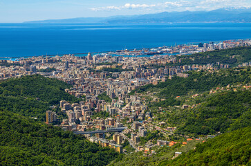 Fototapeta na wymiar Aerial view of the city of Genoa and its port in a sunny day, Italy.
