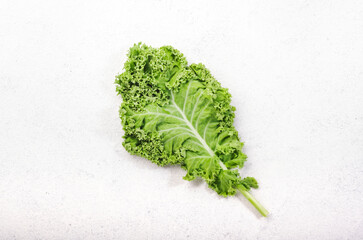 Kale cabbage. Green vegetable leaves, top view on white background, healthy eating, vegetarian food