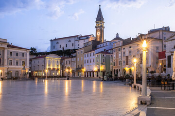 Naklejka premium Picturesque Tartini Square in Piran Slovenia Illuminated at Blue Hour