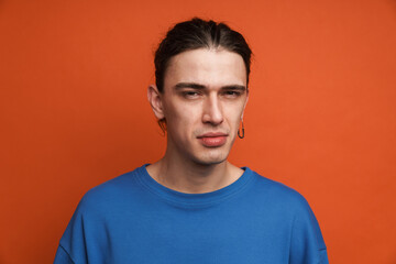 Fototapeta premium Portrait of a pensive confused young white casual man