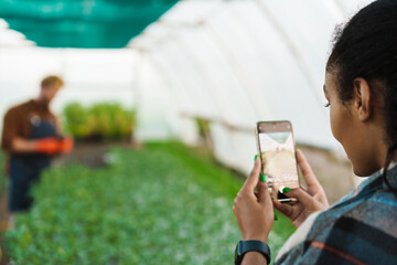 Happy middle aged multiethnic couple working