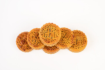 Golden moon cakes on a white background.The moon cakes are engraved with 