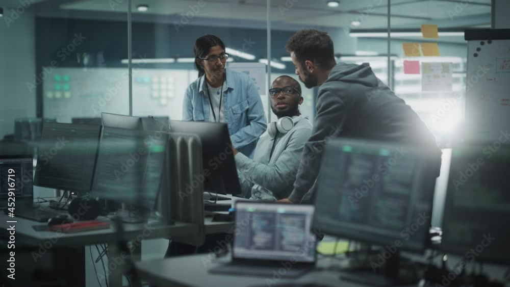 Poster Diverse Team in Modern Office: IT Programmers Gather Around Computer, Talking, Finding Solution. Specialists Create Software. Engineers Develop App, Program. Rack Focus Computers to People