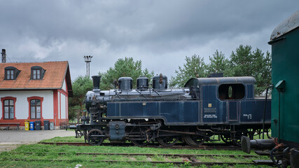 Old historic train depot blue locomotive side view