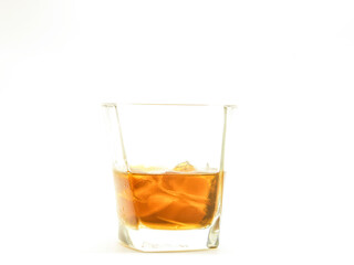 Alcohol drink in glass with ice isolated on white background