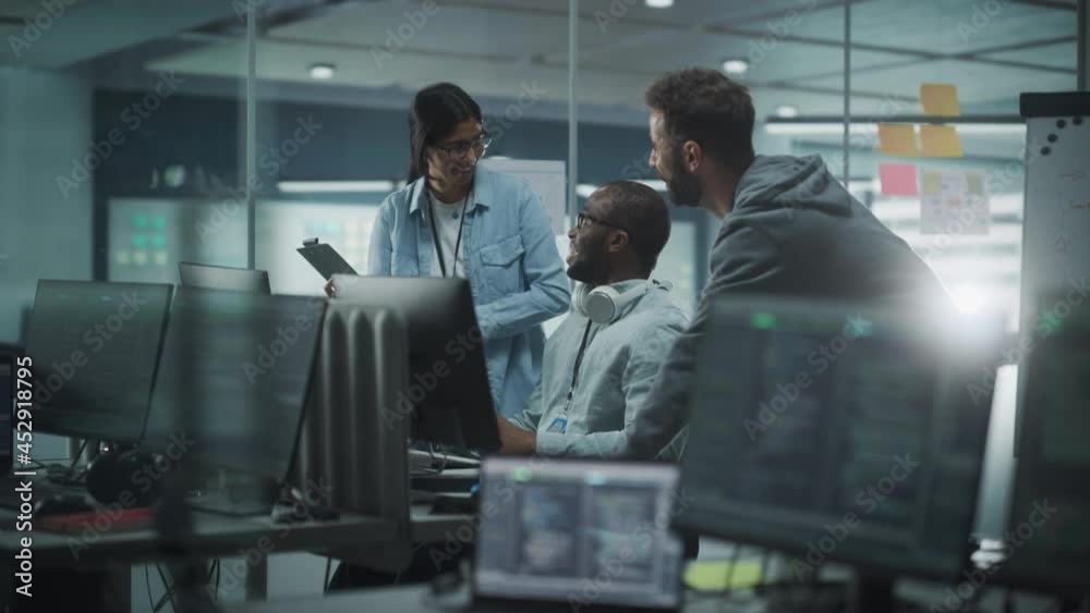 Poster diverse group of professionals celebrate success in modern office: it programmers use computer, talk