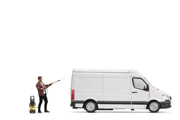 Full length shot of a man cleaning a white van with a pressure washer machine