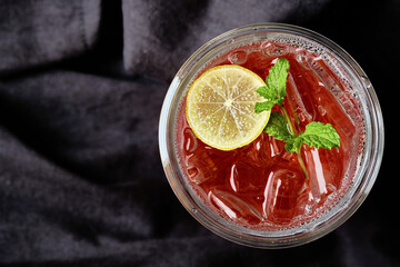 Mocktail - Strawberry Soda with Slice Lemon and Mint Leaf.