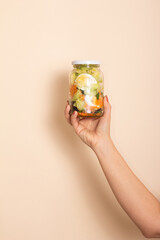 Homemade salad in glass jar with eggs and vegetables. Healthy food, diet, detox, clean eating and vegetarian concept with copy space.