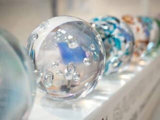 Decorative clear glass ball paperweight with bubble details