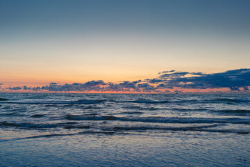 Fototapeta na wymiar Sea at sunset with beautiful clouds