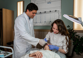 A doctor cosmetologist performs a lip contouring procedure for a young woman in a beauty parlor using the Russian lips technique. Lip augmentation. Botulinum therapy. Botox. Cosmetology and skin care.