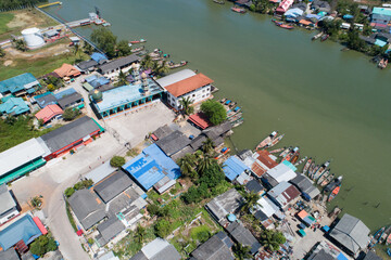 Aerial view top down view of a group of fishing vessels or boats in a fishing village Drone view above the fishing village.
