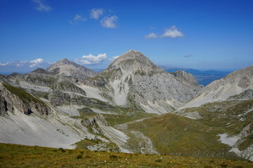 Gran Sasso National park valley view from the top of the mountain on a summer trekking day, Campo...