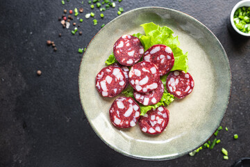 sausage smoked meat piece of bacon beef or pork dry-cured meal snack on the table copy space food background rustic 