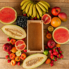 Fresh fruits on wooden background with copy space, colorful fruits. Food concept. Copy space