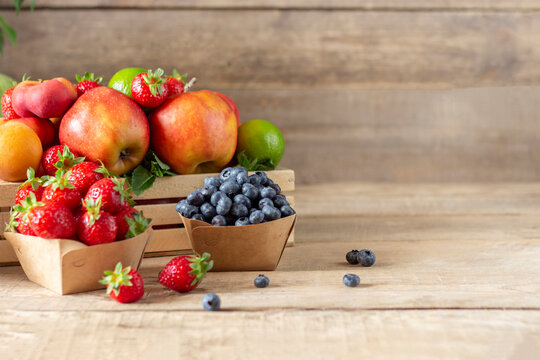 Fresh fruits. Healthy food. Mixed fruit, apricots and peaches. Copy space
