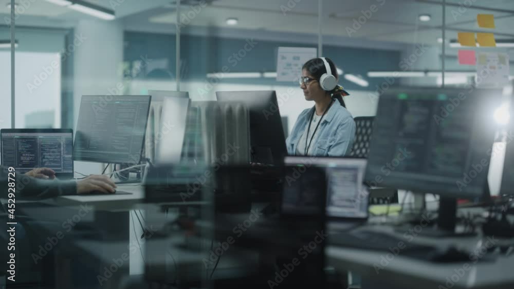 Aufkleber Diverse Office: Indian IT Programmer Working on Computer. Female Specialist Creating Innovative Software. Engineer Developing App, Program, Video Game. Wearing Headphones Listening Podcast, Music