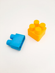 blue and yellow puzzle kids toy on white background