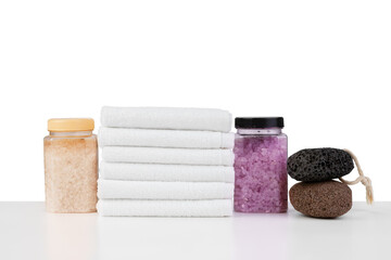 Spa still life with stacked of stone and towel isolated on white