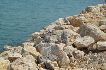 Fototapeta na wymiar Light color rocks, stones - Sea Coast - granit