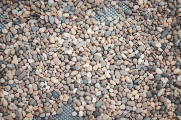 Pebble stones background placed on net decoration garden