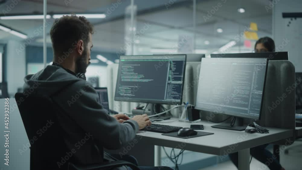 Aufkleber Diverse Office: IT Programmer Working on Desktop Computer. Male Specialist Creating Innovative Software Engineer Developing App, Program, Video Game. Terminal with Coding Language. Over Shoulder
