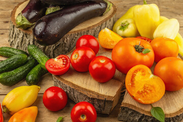 Assortment of fresh vegetables on a wooden background