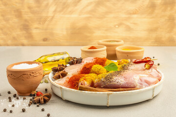 Chicken and curry spices. Set of raw ingredients for cooking traditional food