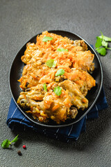 Stewed spicy chicken with vegetables  in cast iron skillet. Space for text.