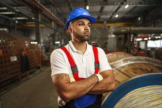 Portrait of african american male handyman working in an industrial factory