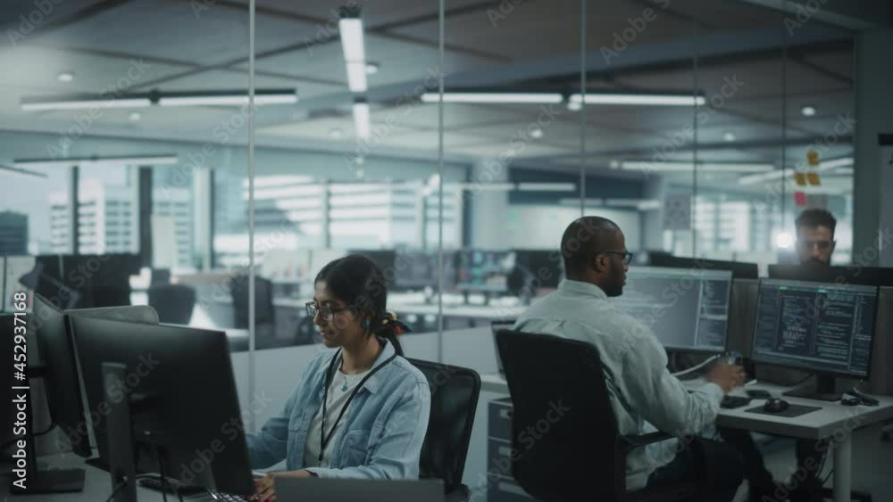 Poster Diverse Office: Portrait of Confident Indian IT Programmer Working on Desktop Computer in Friendly Multi-Ethnic Environment. Female Software Engineer Wearing Glasses Develop Inspirational App