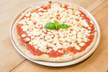 Traditional Italian pizza margherita with tomatoes, mozzarella cheese. Selective focus