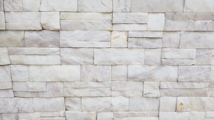 The walls are made up of small pieces of marble arranged in a row.