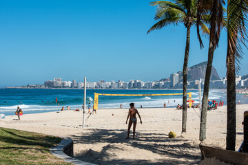 Walking through the beautiful beach of Copacabana