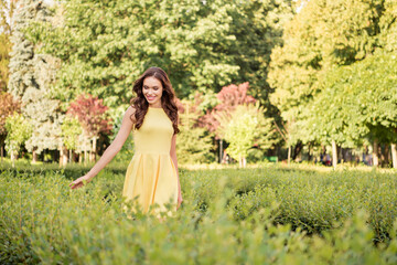 Photo of young cheerful pretty woman happy positive smile walk park green trees sunny weather outdoors