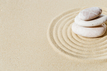 Aesthetic minimal background with zen stone on sand. Japanese Zen Garden with concentric circles...