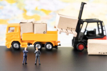 Miniature business man planning thinking success deal business package delivery using as commitment, global commercial, international investment and partnership business development joint venture deal