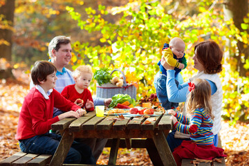 Picnic in autumn park. Family fall barbeque party.