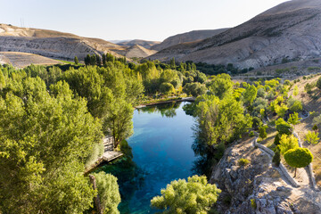 Gorgeous Gökpınar pond and picnic park with its clear turquoise water and underwater plants in green natüre area. Sivas - Gürün TURKEY