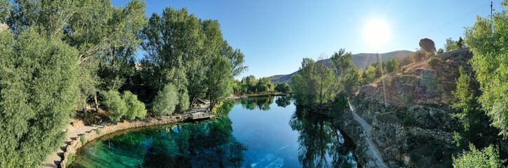 Gorgeous G&ouml;kpınar pond with its clear turquoise water and underwater plants in green nature, Panoramic view. Sivas - G&uuml;r&uuml;n TURKEY
