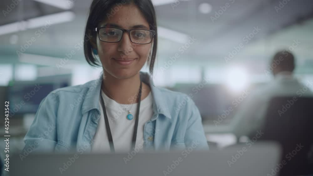 Poster Diverse Office: Portrait of Beautiful Indian IT Programmer Working on Desktop Computer. Empowered Female Software Engineer Creating Innovative App, Program, Video Game in Friendly Environment