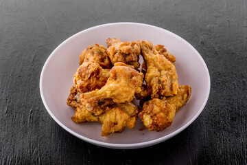Fried chicken on dark background