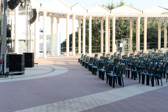 Empty Plastic Chairs In Front Of A Stage In The Main Square In Calpe In Alicante, Spain