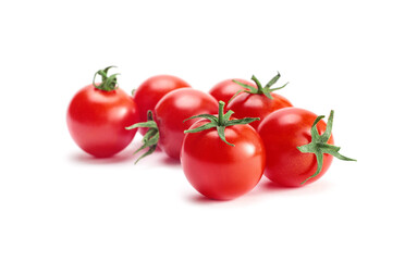 Group of cherry tomatoes isolated on white background, selective focus in the foreground.
